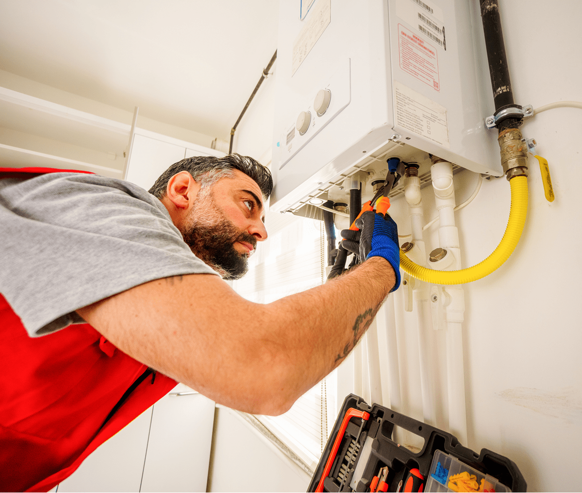 Technician fixing a gas boiler